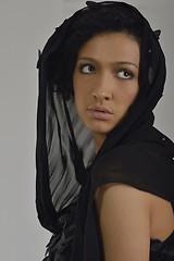 Image showing elegant woman in fashionable dress posing in the studio