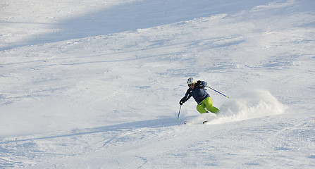 Image showing skiing on fresh snow at winter season at beautiful sunny day