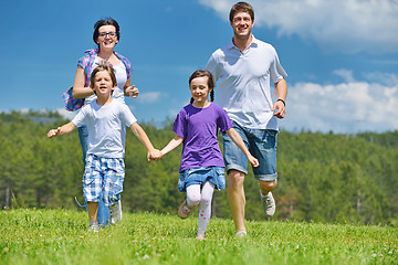 Image showing happy young family have fun outdoors