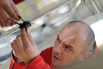 Image showing Male solar panel engineer at work place