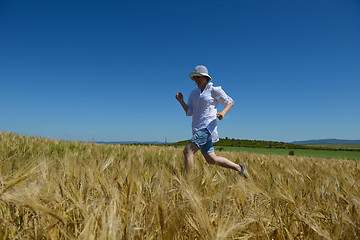 Image showing young woman in wheat field at summer