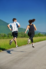 Image showing Young couple jogging at morning