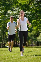 Image showing Young couple jogging