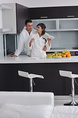 Image showing young couple have fun in modern kitchen