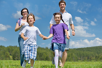 Image showing happy young family have fun outdoors