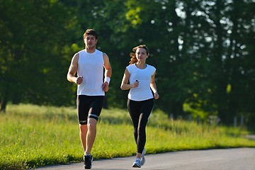 Image showing Young couple jogging