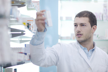 Image showing pharmacist chemist man in pharmacy drugstore