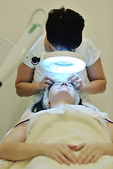 Image showing woman with facial mask in cosmetic studio