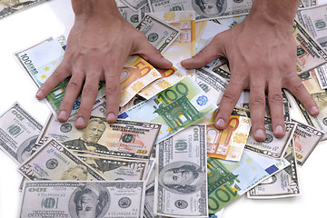 Image showing Business man holding money
