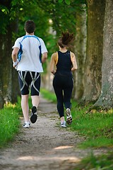 Image showing Young couple jogging