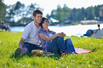 Image showing happy young couple having a picnic outdoor