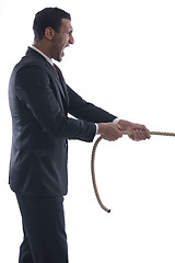 Image showing business man with rope isolated on white background