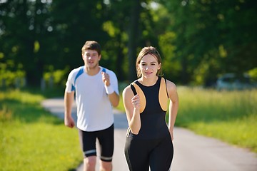 Image showing Young couple jogging at morning