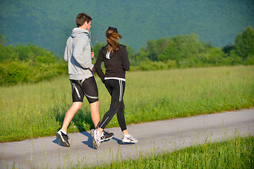 Image showing Young couple jogging