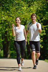 Image showing Young couple jogging