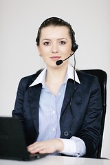 Image showing business woman group with headphones