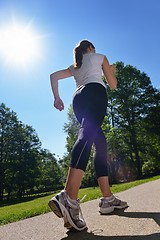 Image showing Young beautiful  woman jogging at morning in park