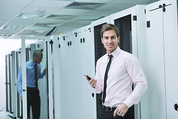 Image showing it enineers in network server room