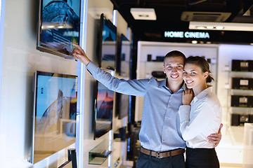 Image showing Young couple in consumer electronics store