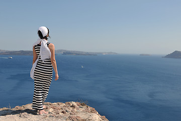 Image showing Greek woman on the streets of Oia, Santorini, Greece