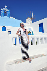 Image showing Greek woman on the streets of Oia, Santorini, Greece