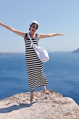 Image showing Greek woman on the streets of Oia, Santorini, Greece