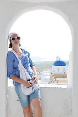 Image showing Greek woman on the streets of Oia, Santorini, Greece