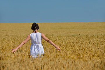 Image showing young woman in wheat field at summer