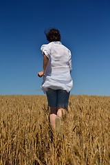 Image showing young woman in wheat field at summer