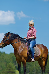 Image showing happy woman  on  horse