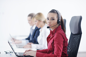 Image showing business woman group with headphones