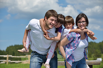 Image showing happy young family have fun outdoors