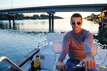 Image showing portrait of happy young man on boat