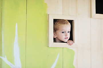 Image showing happy child in a window