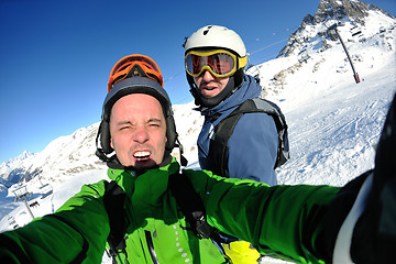 Image showing winter portrait of friends at skiing