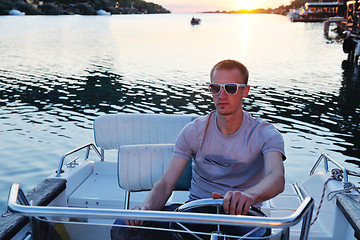 Image showing portrait of happy young man on boat