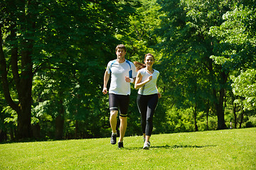 Image showing Young couple jogging at morning