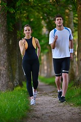 Image showing Young couple jogging