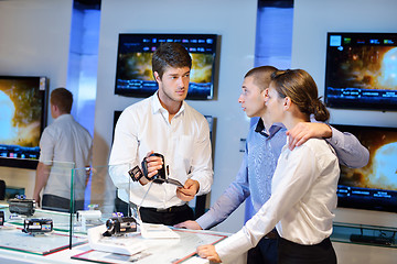 Image showing Young couple in consumer electronics store