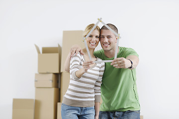 Image showing Young couple moving in new home