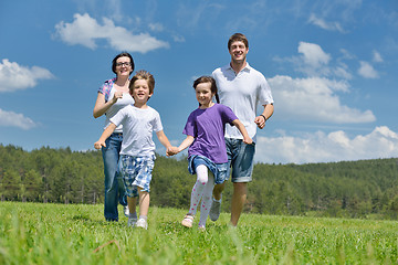 Image showing happy young family have fun outdoors