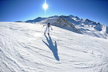 Image showing skiing on fresh snow at winter season at beautiful sunny day