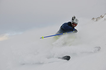 Image showing skiing on fresh snow at winter season at beautiful sunny day