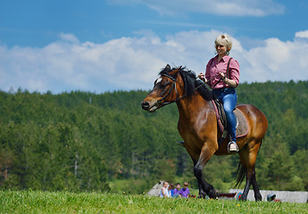 Image showing happy woman  on  horse