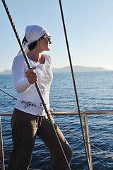 Image showing Greek woman on the streets of Oia, Santorini, Greece