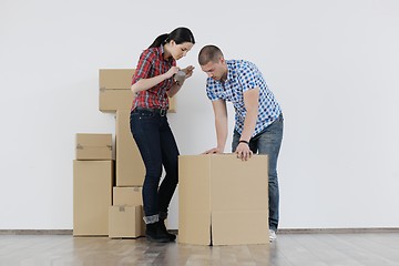 Image showing Young couple moving in new house