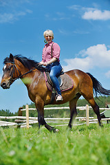 Image showing happy woman  on  horse