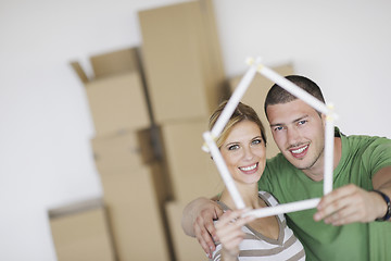 Image showing Young couple moving in new home