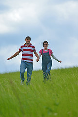 Image showing Portrait of romantic young couple smiling together outdoor