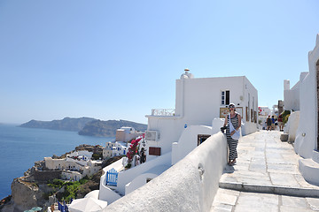 Image showing Greek woman on the streets of Oia, Santorini, Greece